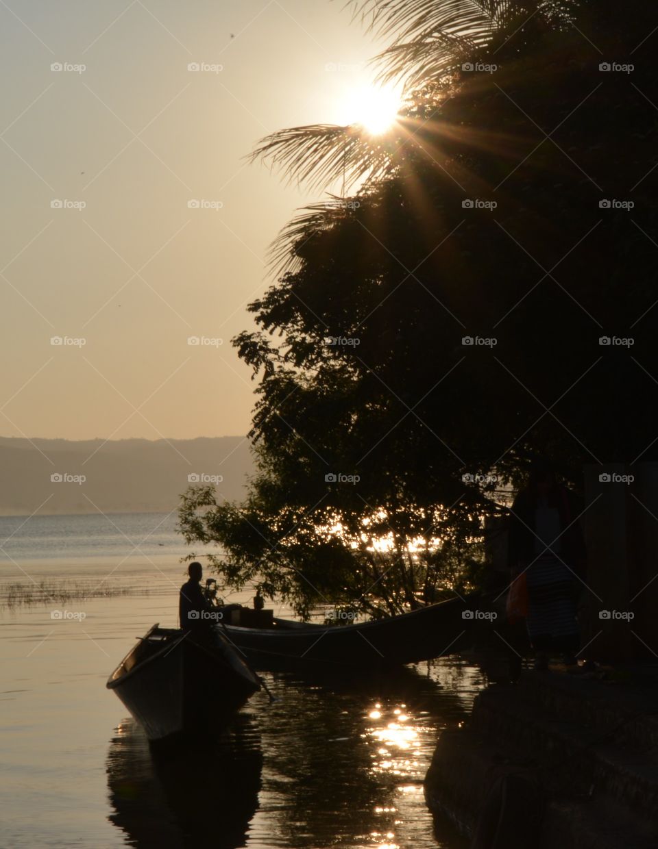 Silhouette image of mooring in early morning at Phe Khone, the small town in Shan State, Burma (Myanmar)