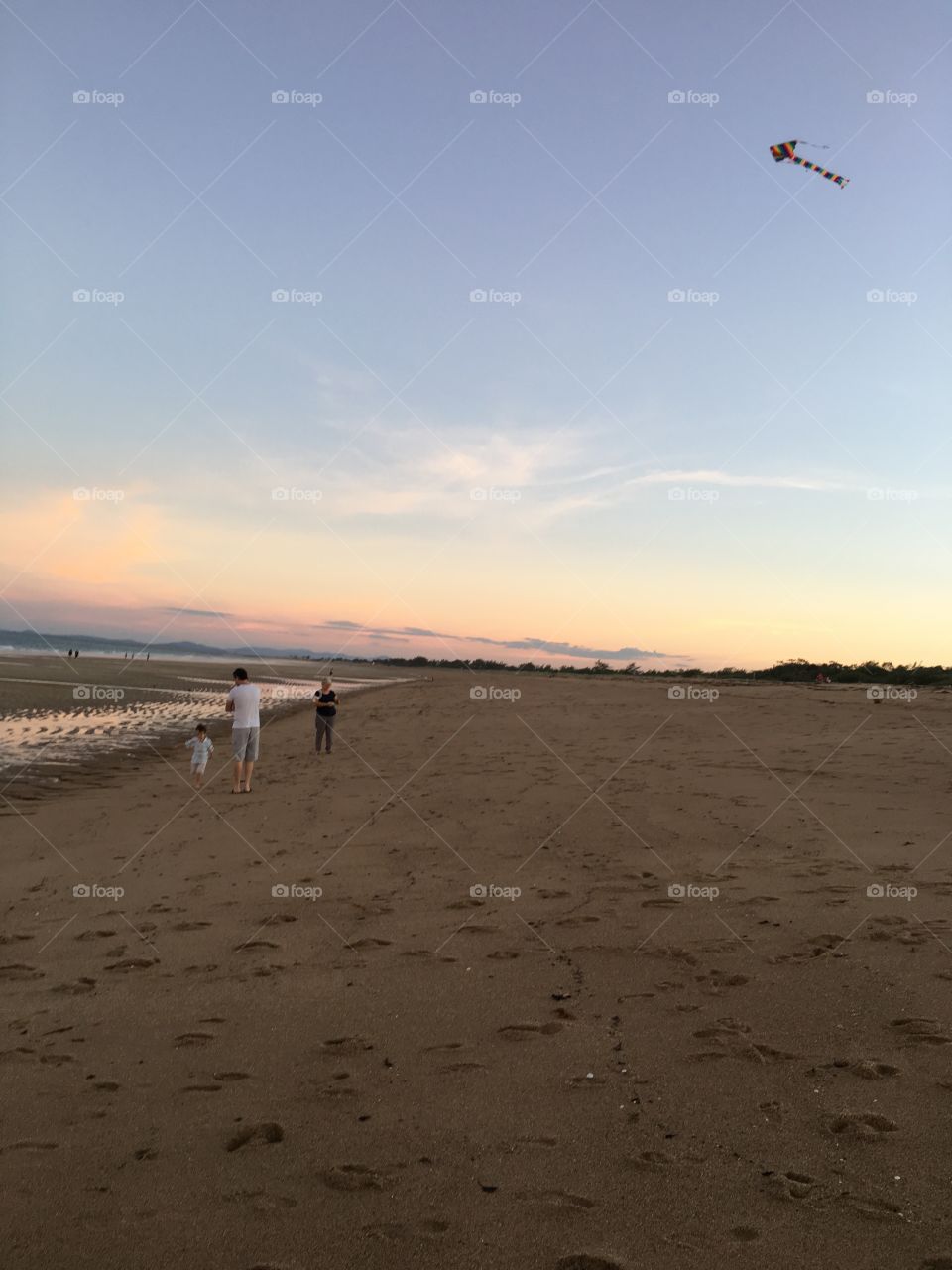 What a lovely afternoon at the beach for this family flying a kite. The little boy with them was having a blast. Photo taken with permission. 