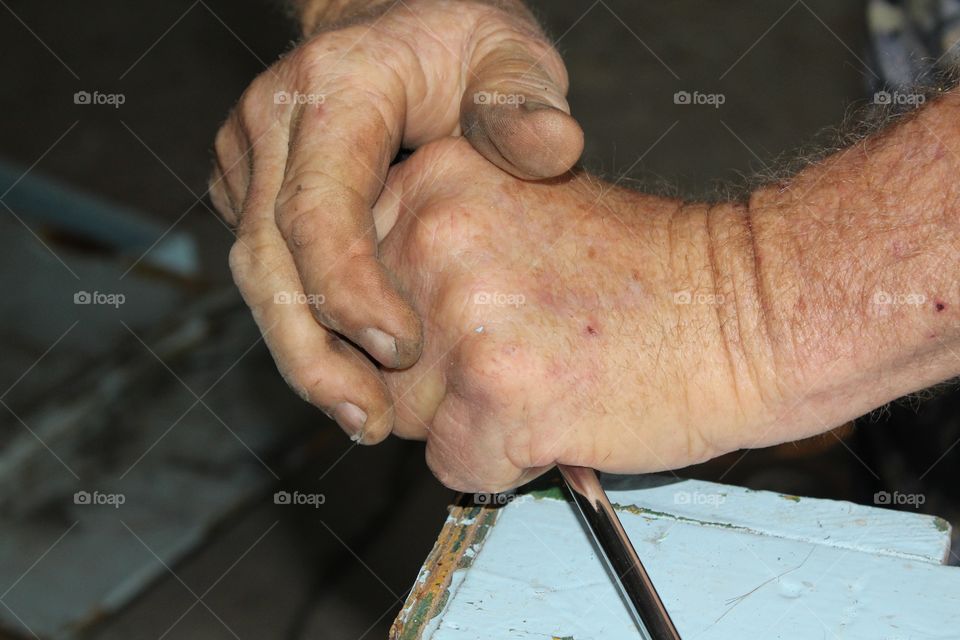 Close-up of working carpenter's hand