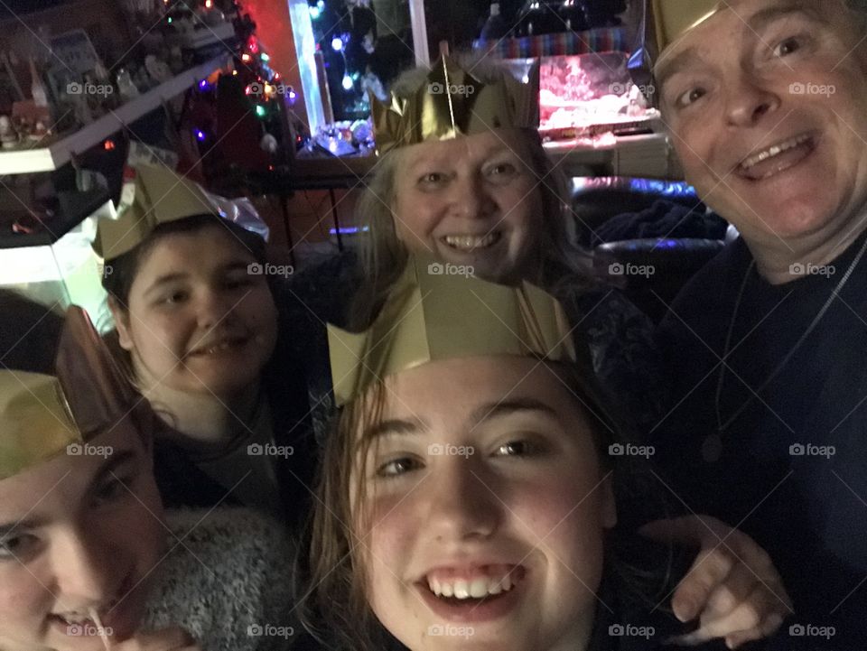 Christmas selfie! Freshly stuffed with a delicious turkey dinner, the family posed for a selfie complete with Christmas Cracker Crowns, shiny Christmas lights & sparkling smiles! Ho ho ho! ๐