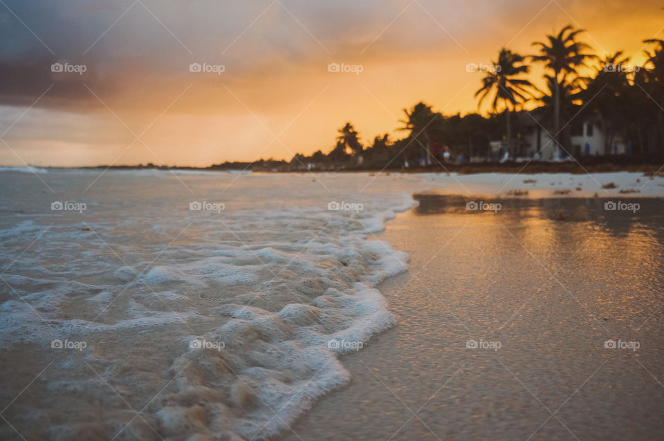 scenic view of beach at sunset
