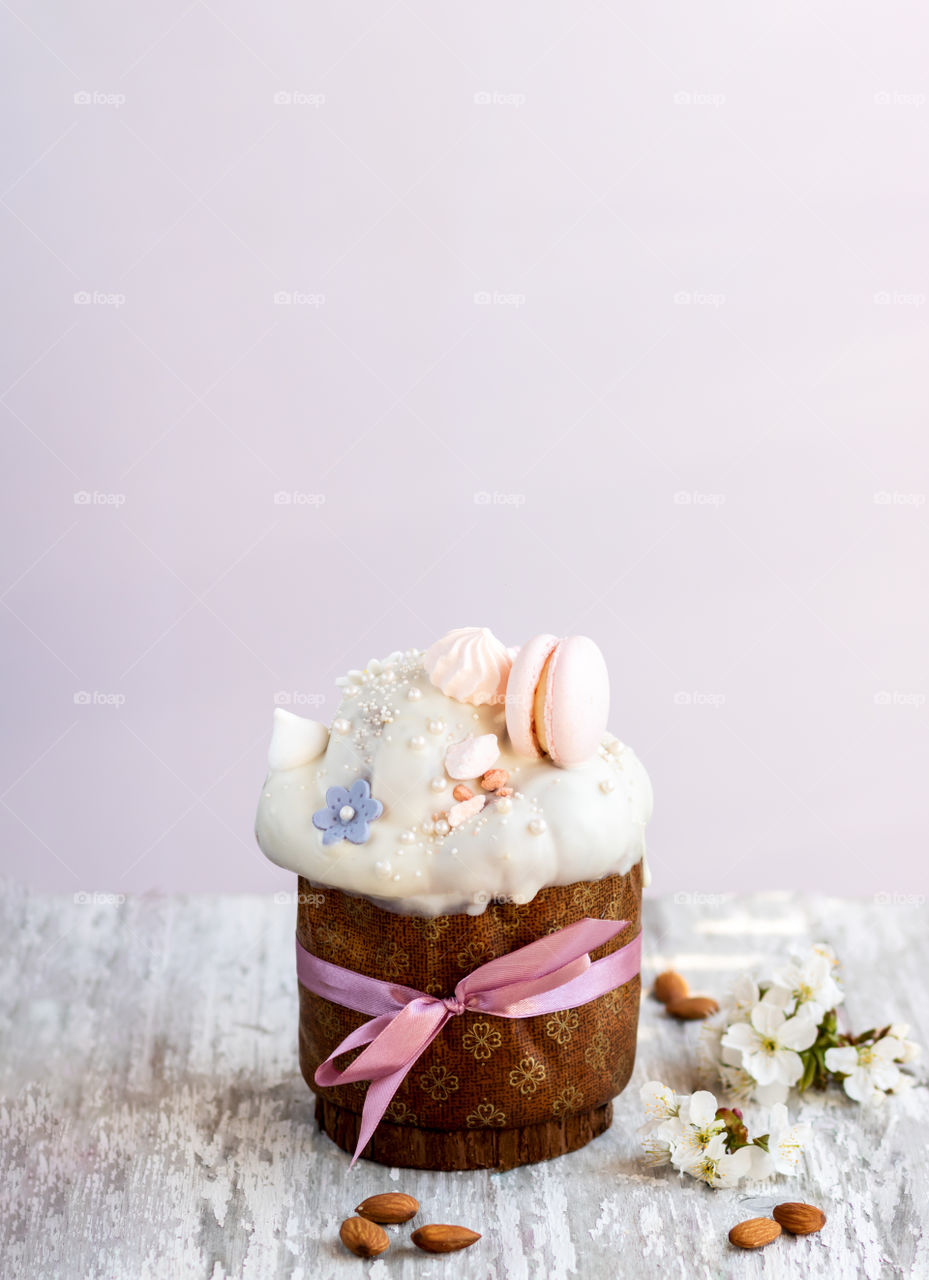 Traditional sweet Easter cake on wooden old table. Copy space.