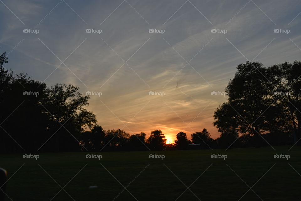 Sunset behind a field   