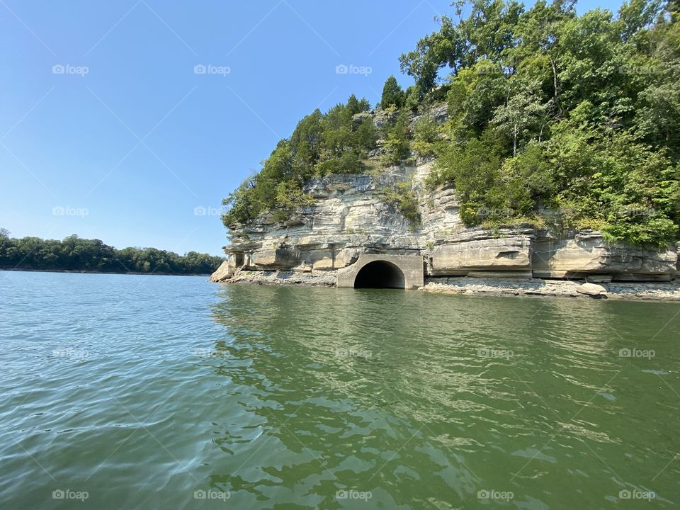 Abandoned road through the mountain leading to a now under water town.