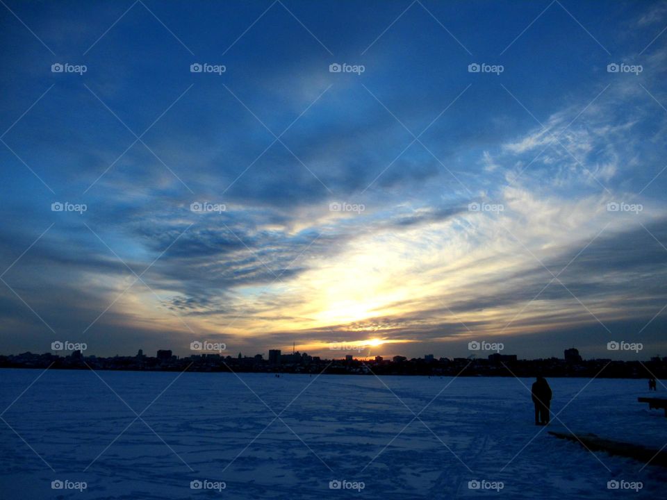 severe winter sky, sunset over the city, frost
