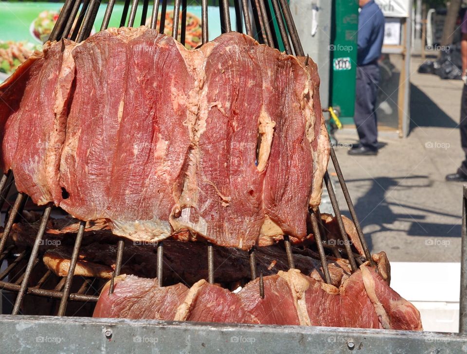 Grilling meat at NYC neighbor street festival