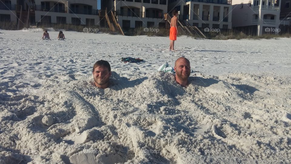 having fun buried in sand Destin Florida