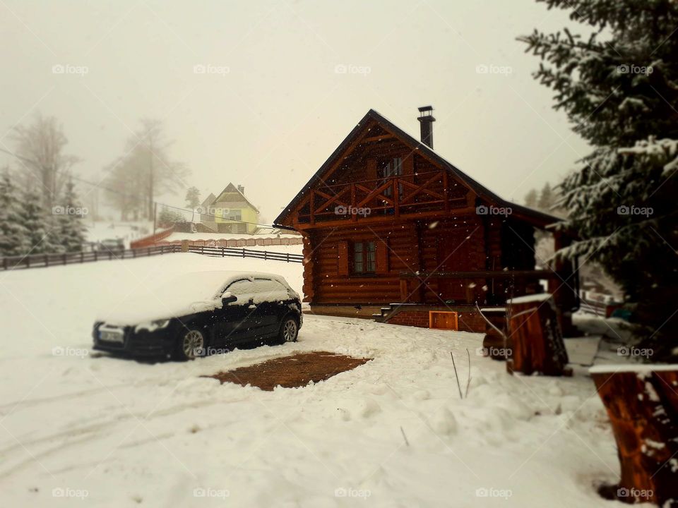 a snowy idyll, a cottage and a car