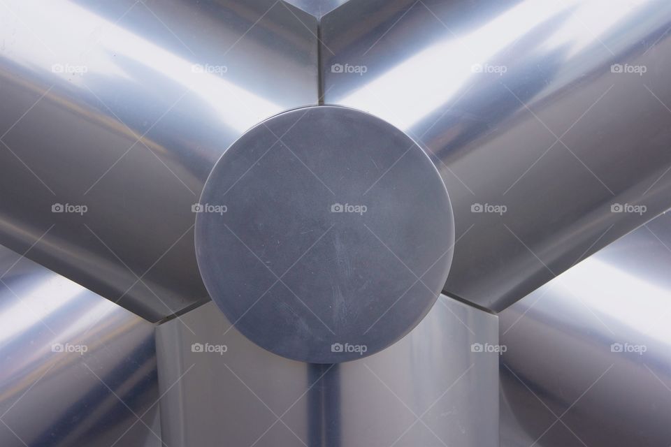 An abstract closeup of an outdoor rotary fan.