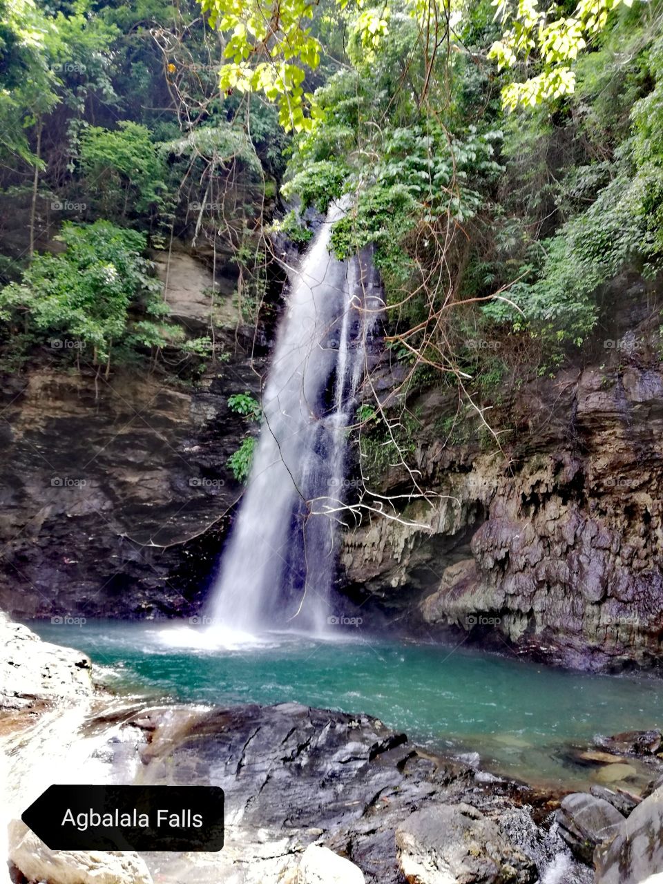 Beautiful hidden waterfall in exotic tropical rainforest in Abra De Ilog, Mindoro, Island of Philippines