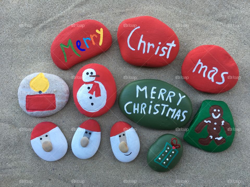 Merry Christmas on carved and colored stones
