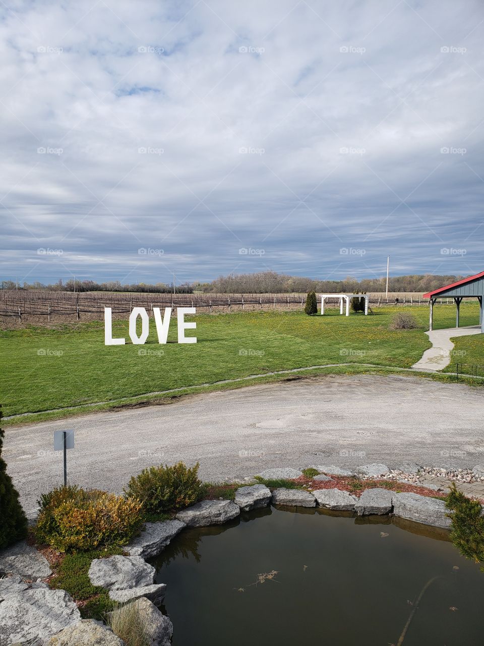 Early evening shot of a "love" sign in the field of a vineyard in Prince Edward County, Niagara.