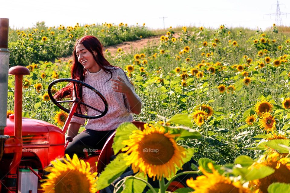 Lady operating a tractor