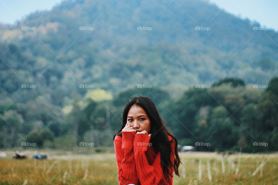 woman wearing a red wool sweater during cold weather