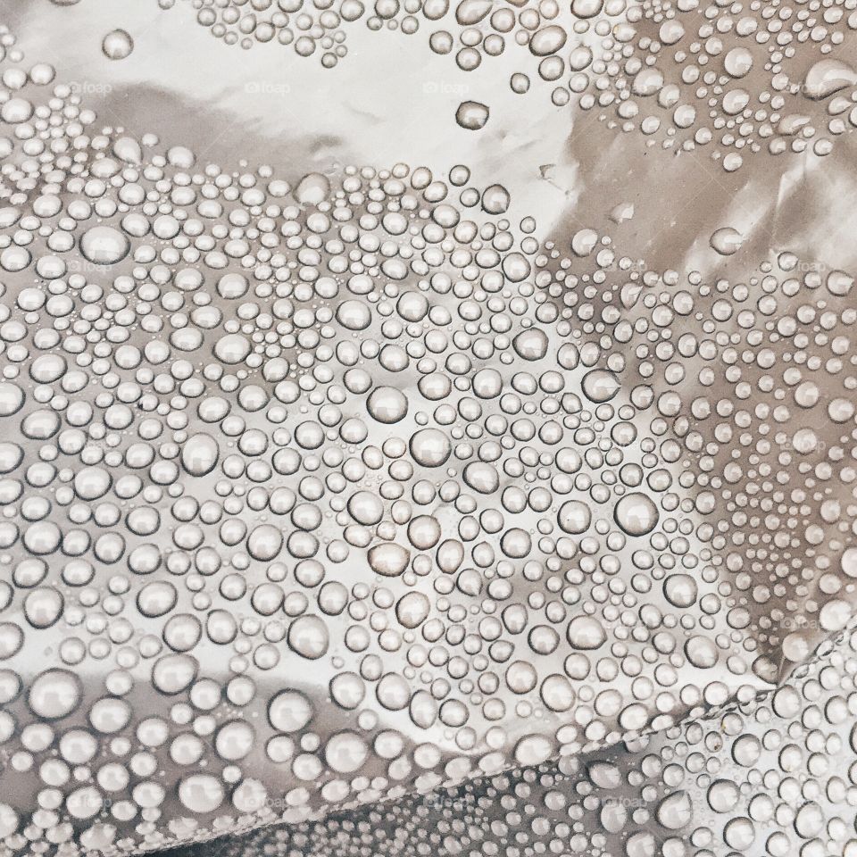 Close-up of water drop on gray background