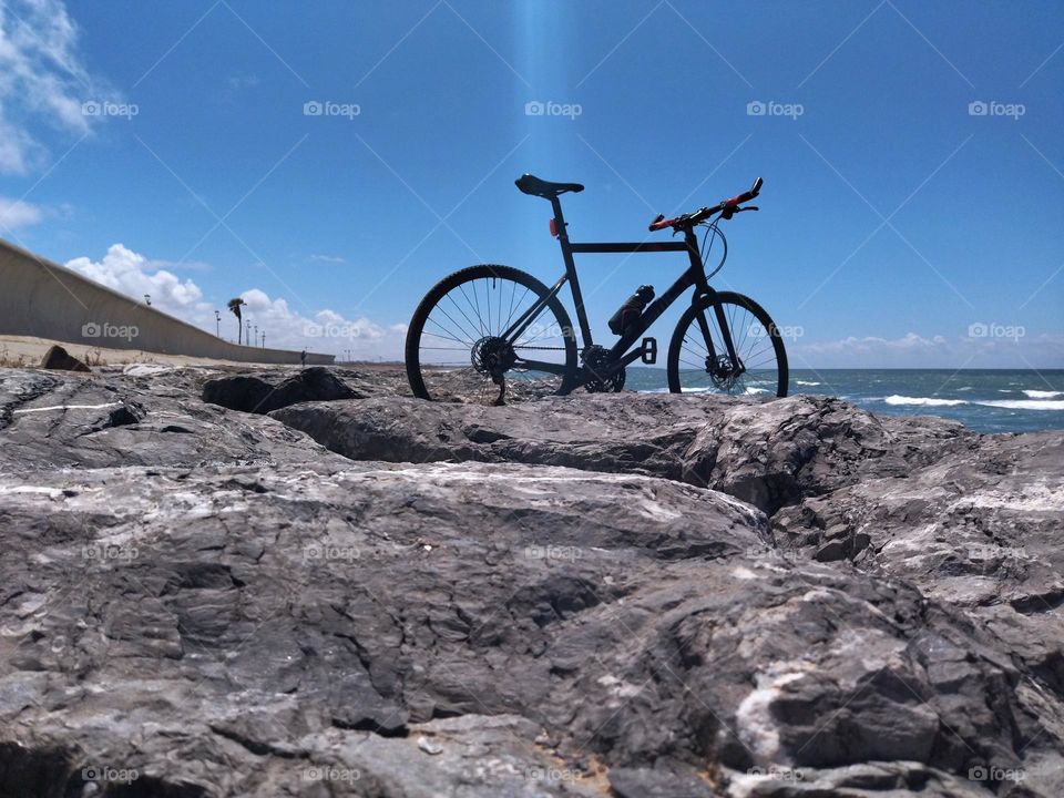 Bike and rock and sunlight