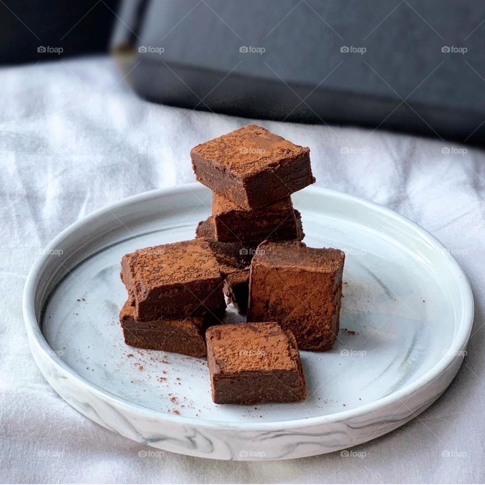 Chocolate ganache with cocoa powder sprinkled that melts in the mouth 