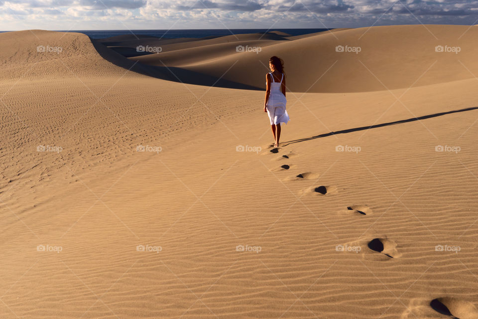 Lonely girl in desert