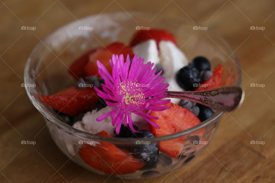 Ice cream with berry fruit in bowl
