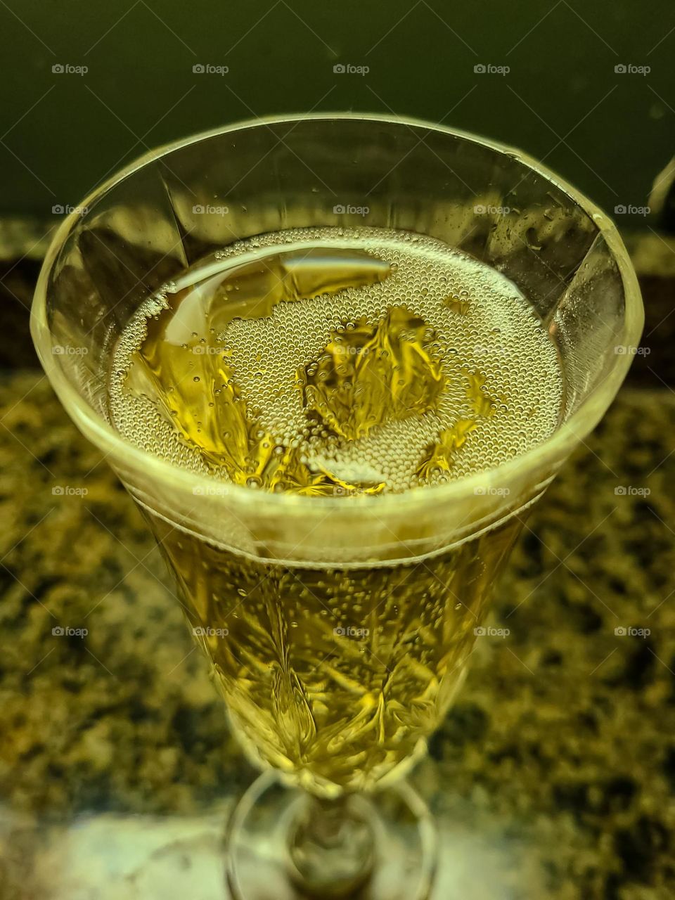 Tasty glass of champagne in a crystal champagne flute, delicious crisp bubbles highlight the sweetness of the libation