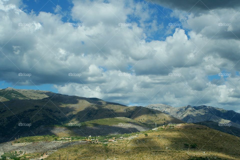 Clouds running on hills
