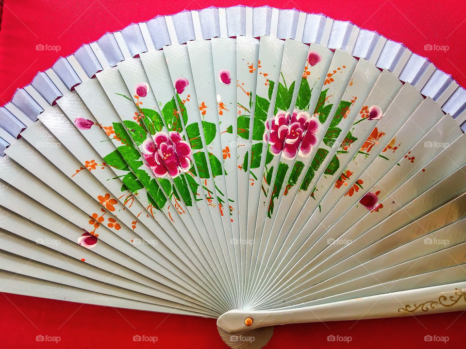 fan on red background