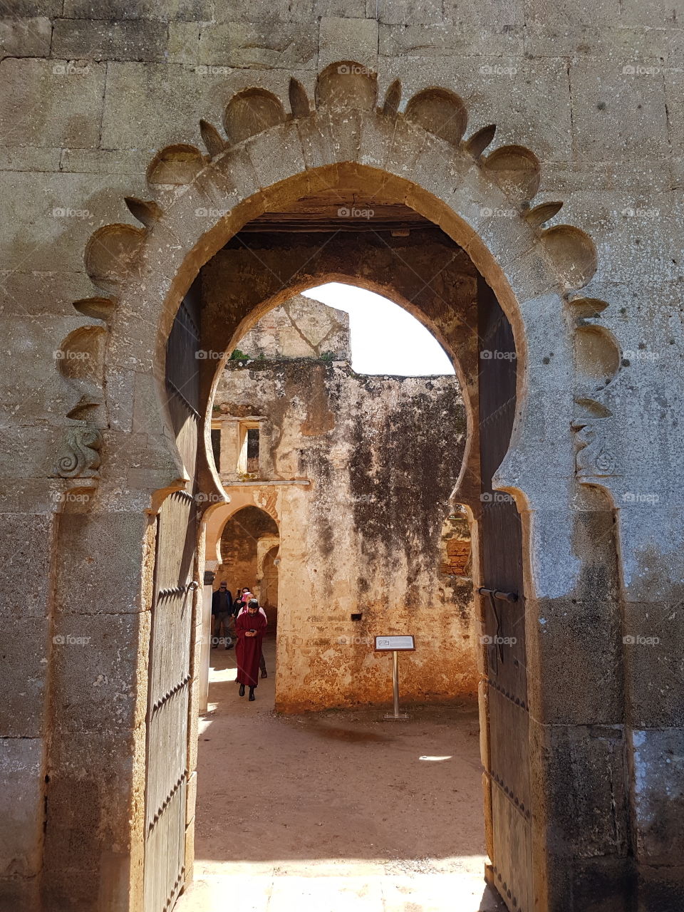 looking through architectural door frame of historic ruins of Mosque at Chellah in Rabat, Morocco, Africa.
