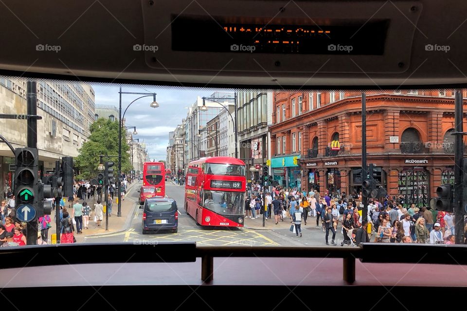 London street from the inside of a typical bus