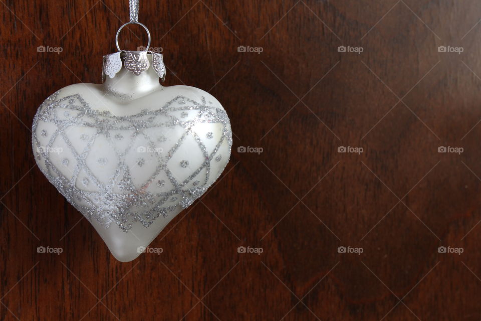 Christmas white heart globe on wooden door