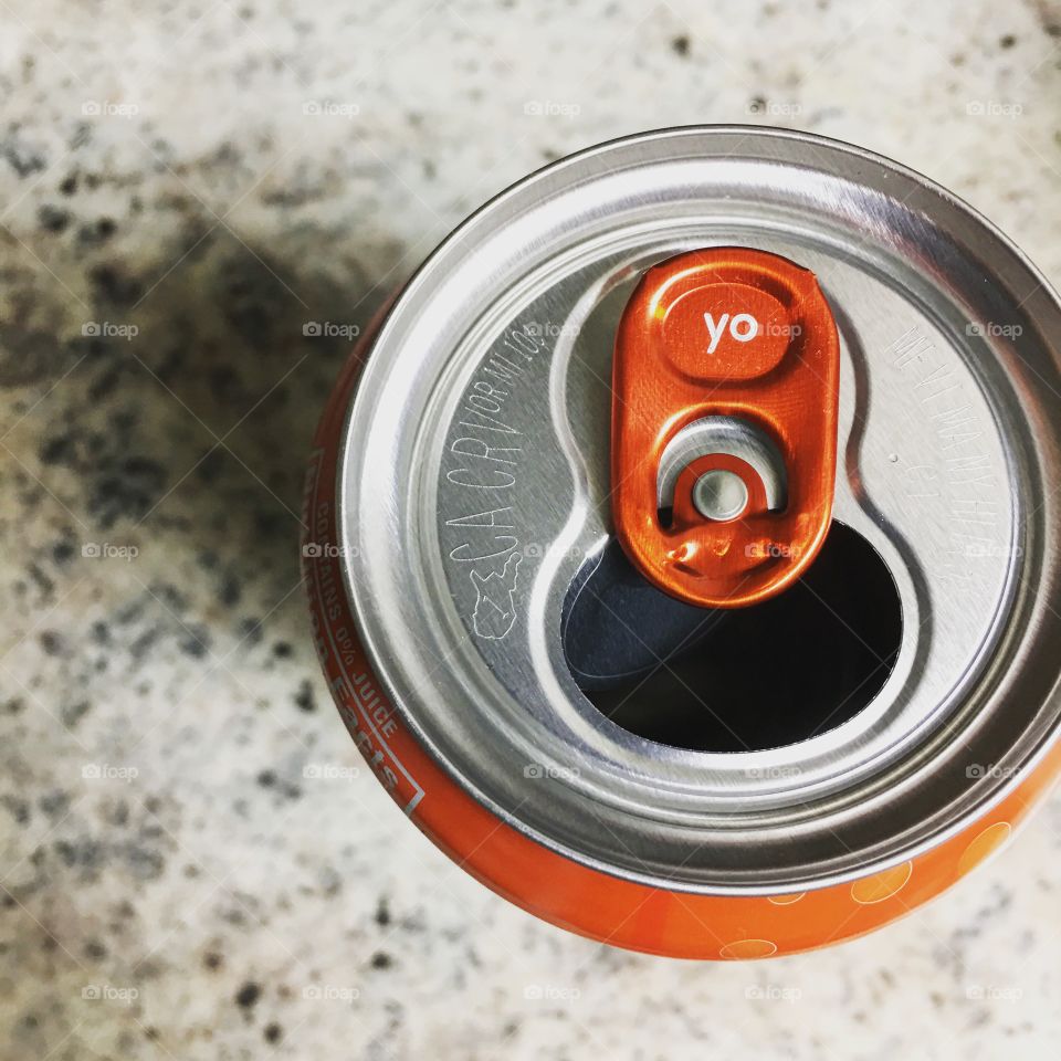 Bubbly orange flavored water in an open can. Yo.