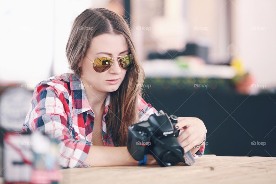 Girl photographer looking at the camera