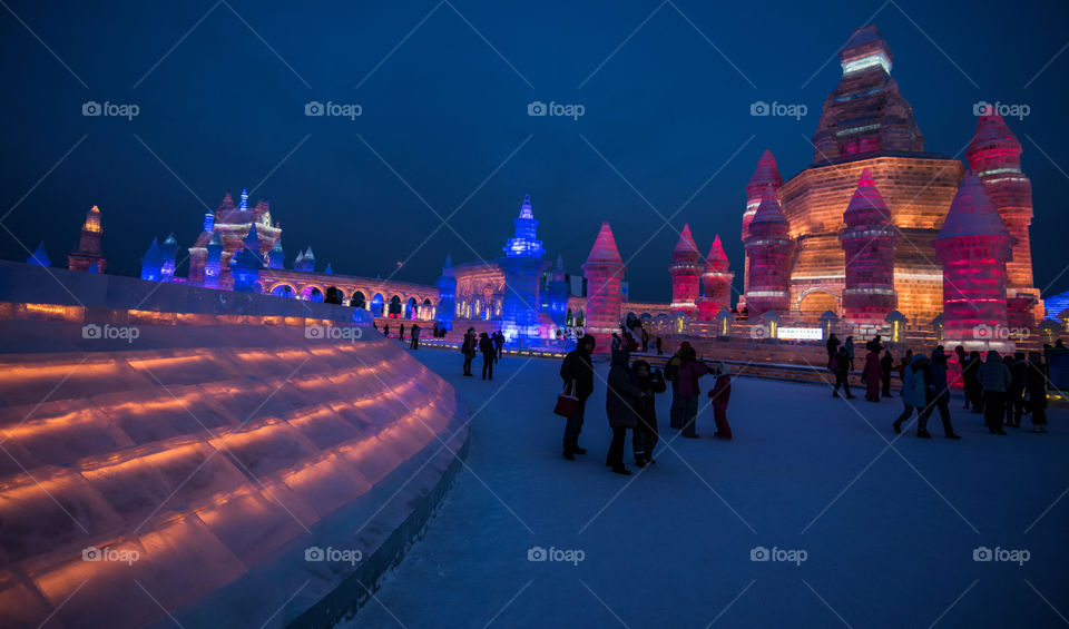 Asia china  Harbin ice Festival snow Festival ice sculptures snow building  snow ice in light colorful ice buildings at night full moon