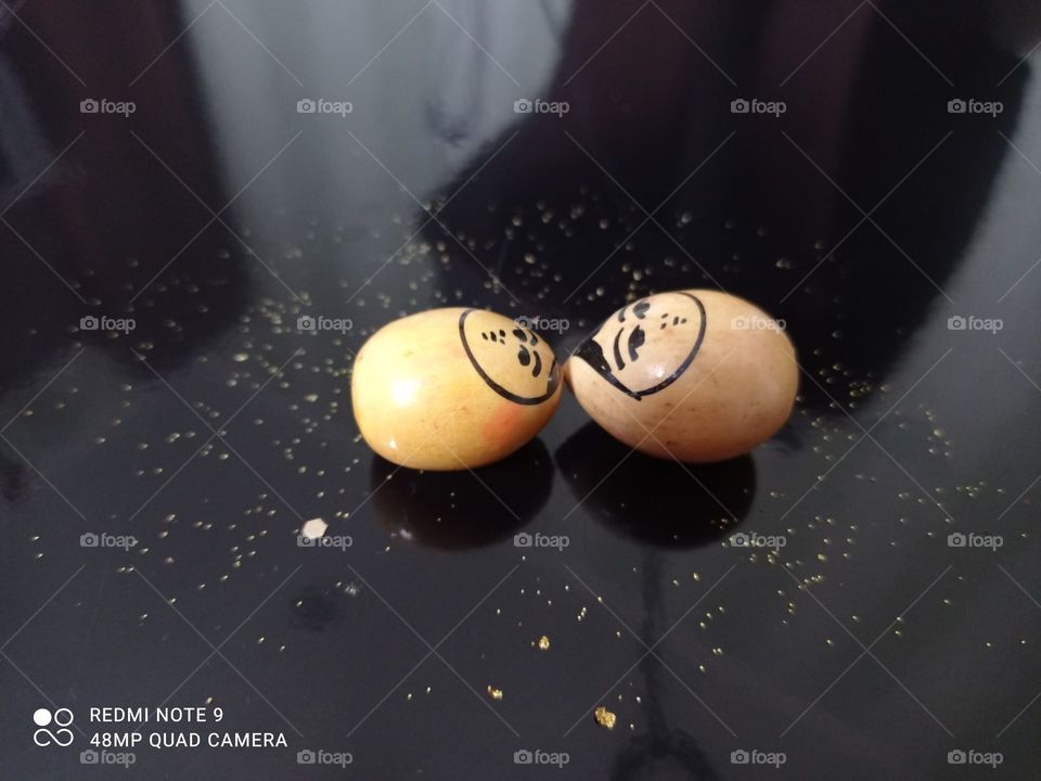 Yellow, small, nesting dolls, on, black, background