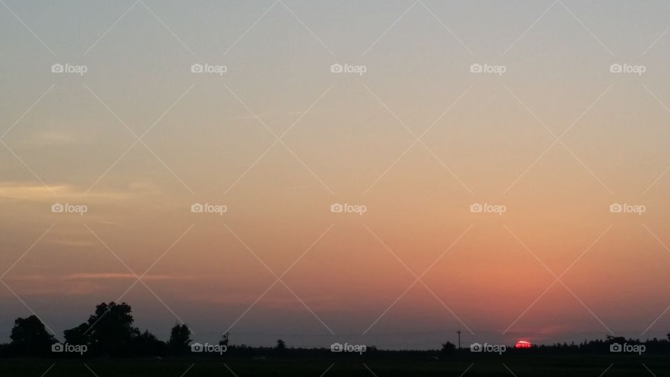 Seconds before sunrise. Driving to work, I pulled over to take pictures of the sun rising