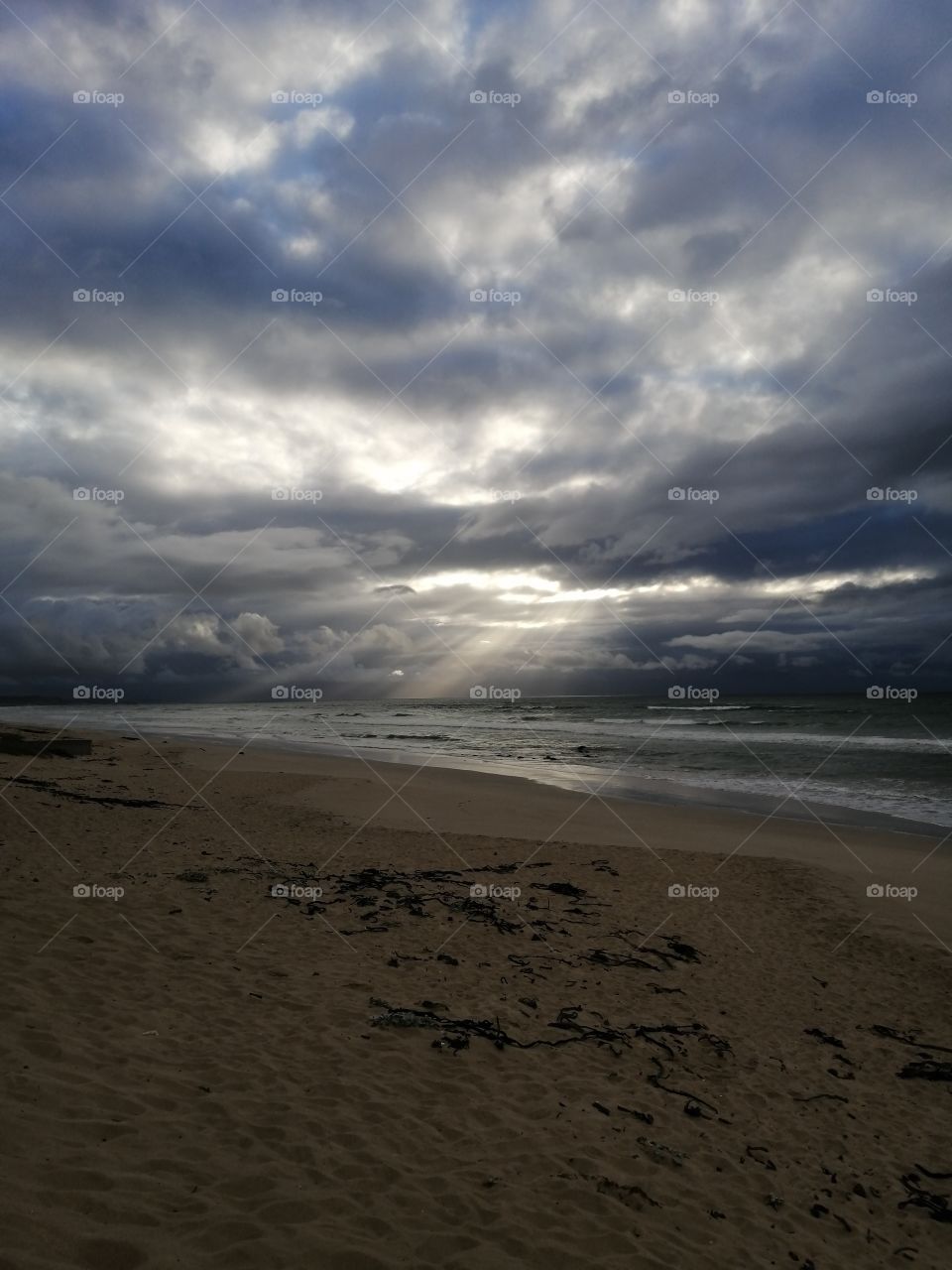 Strandfontein Beach in Cape-Town. Sunrays on the water.