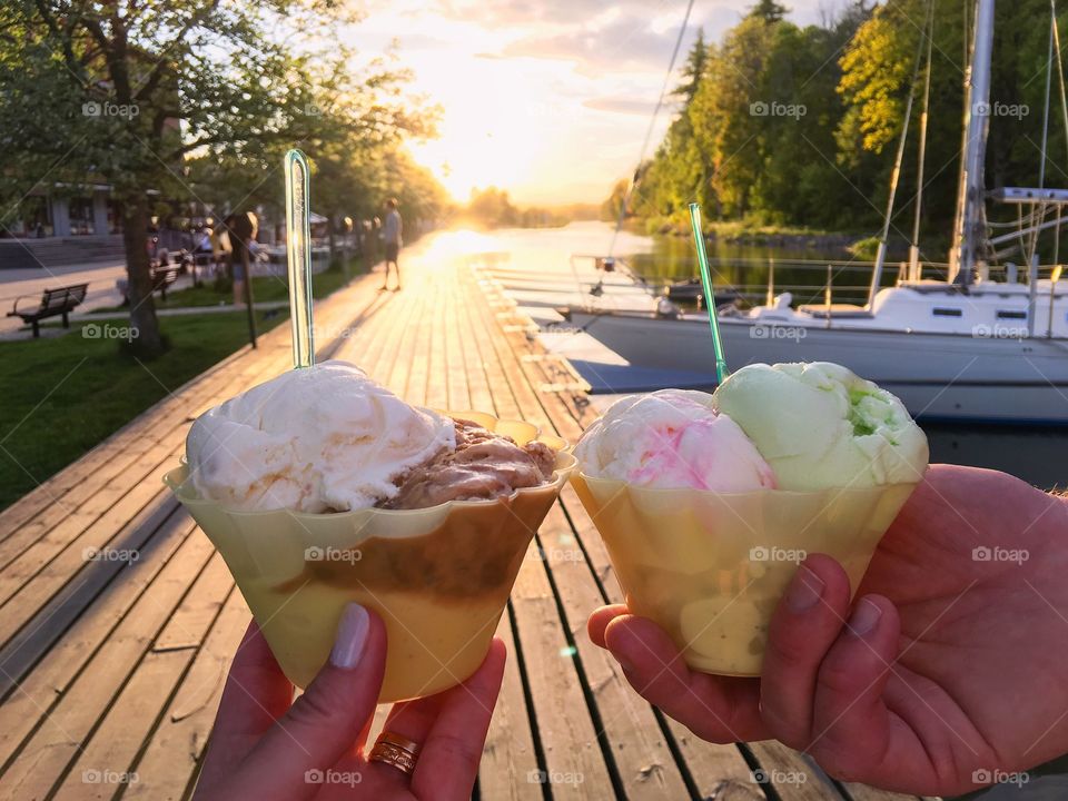 Person's hand holding ice cream