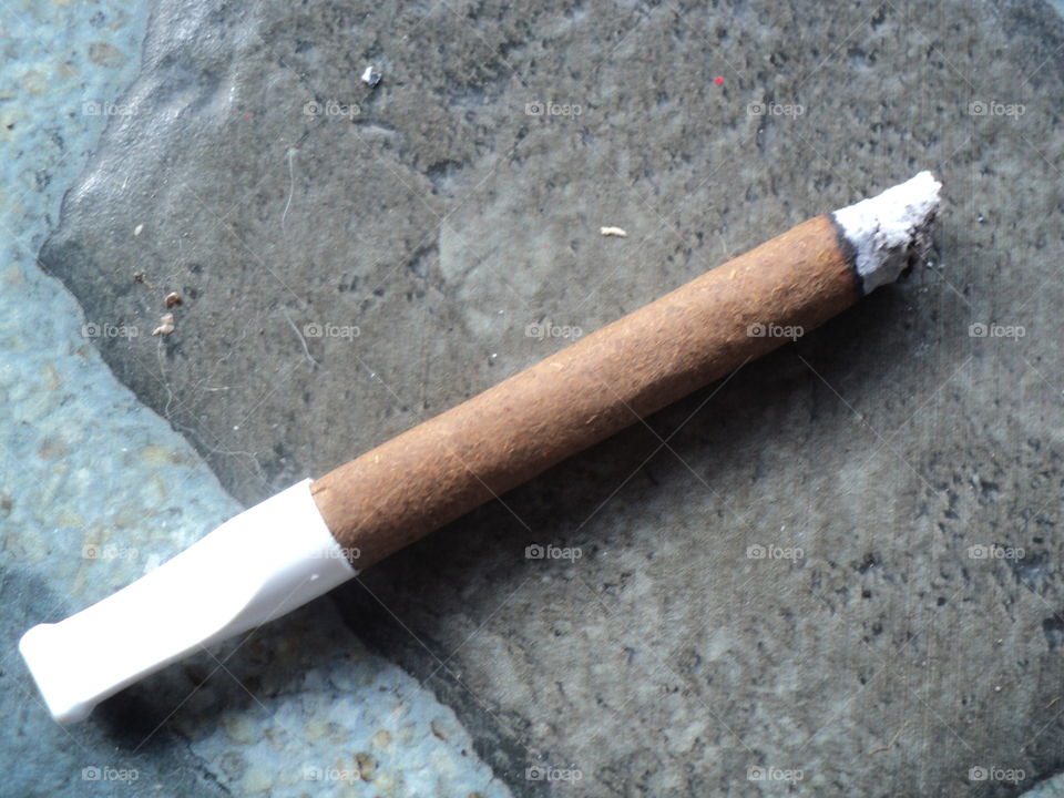 brown cigar with filter