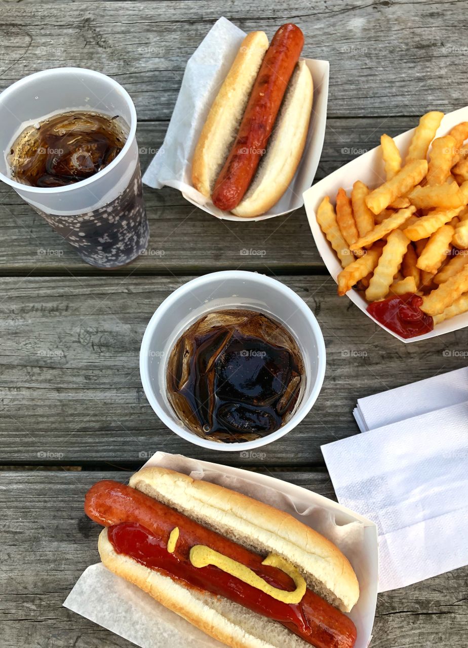 Hot dog and fries with drink