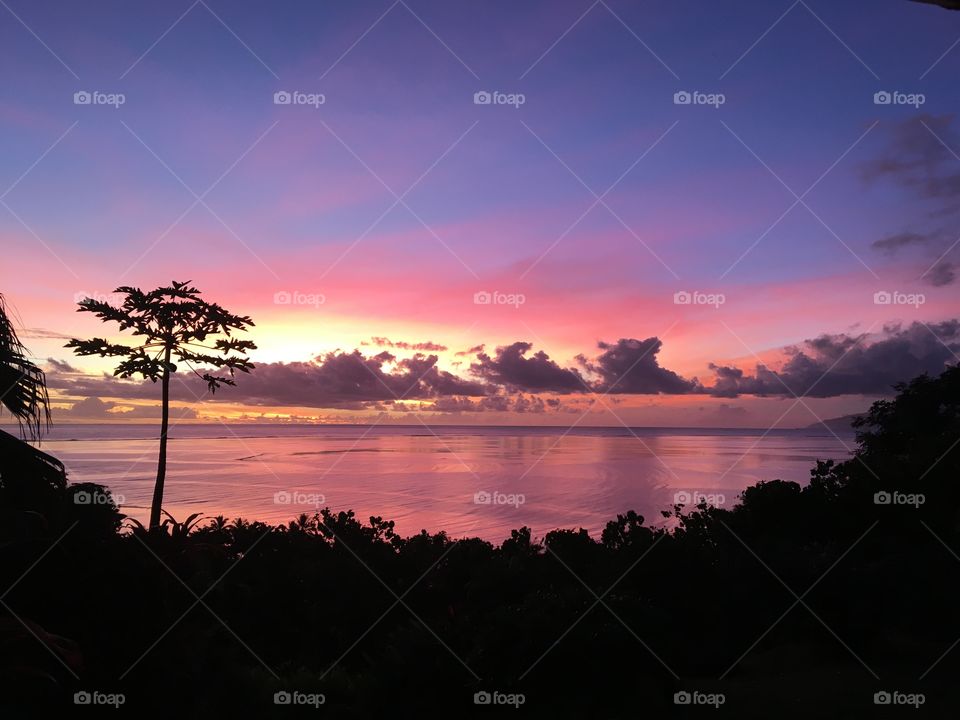 Pinky sunset sky on Tahiti lagoon