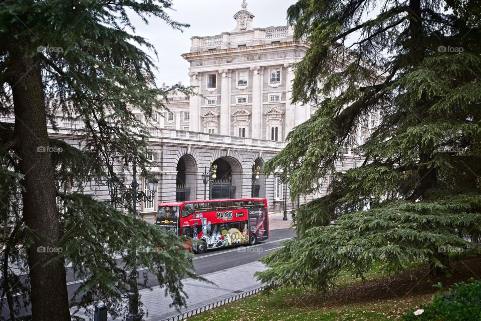 Madrid city touristic tour bus in front of Palacio Real