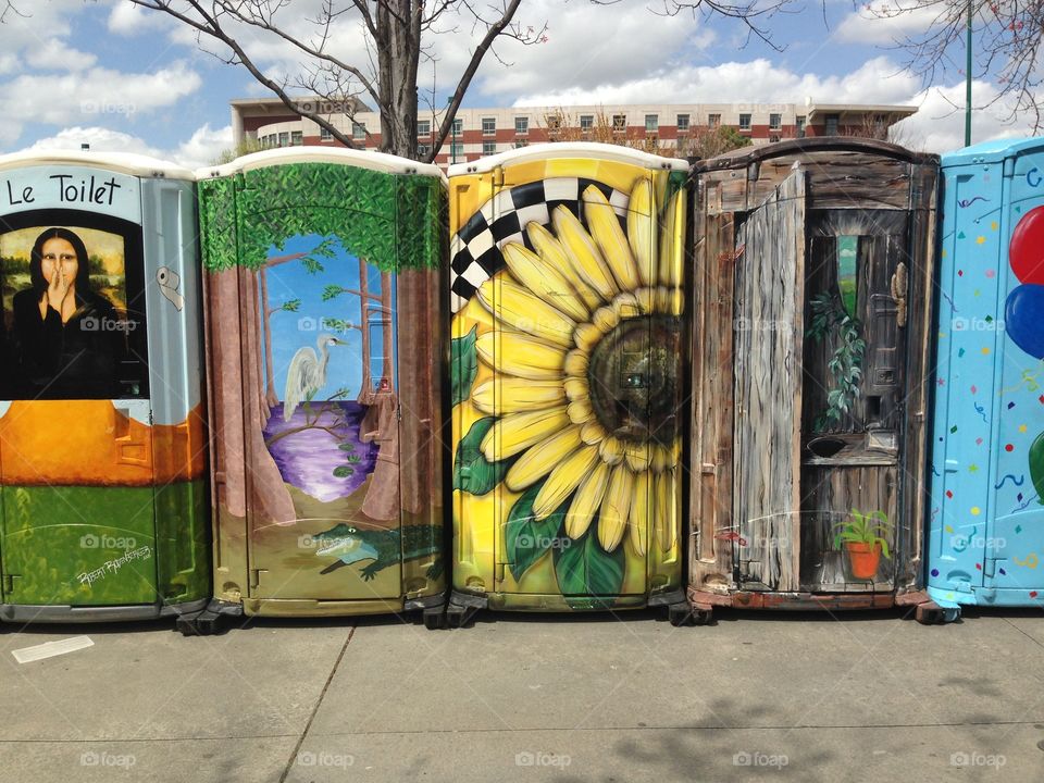 Portable toilets with murals