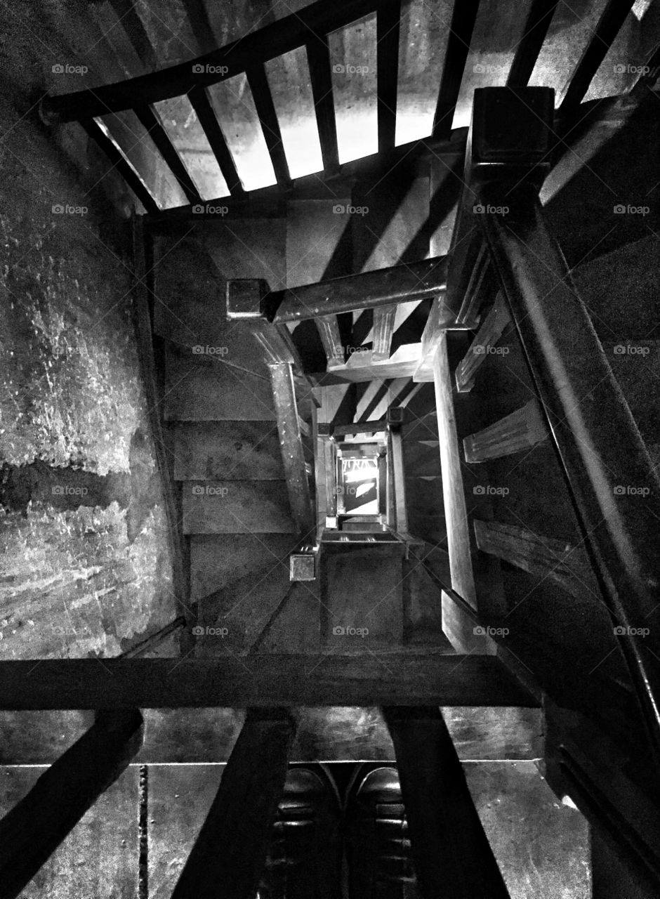 Old wooden staircase in spiral view from above