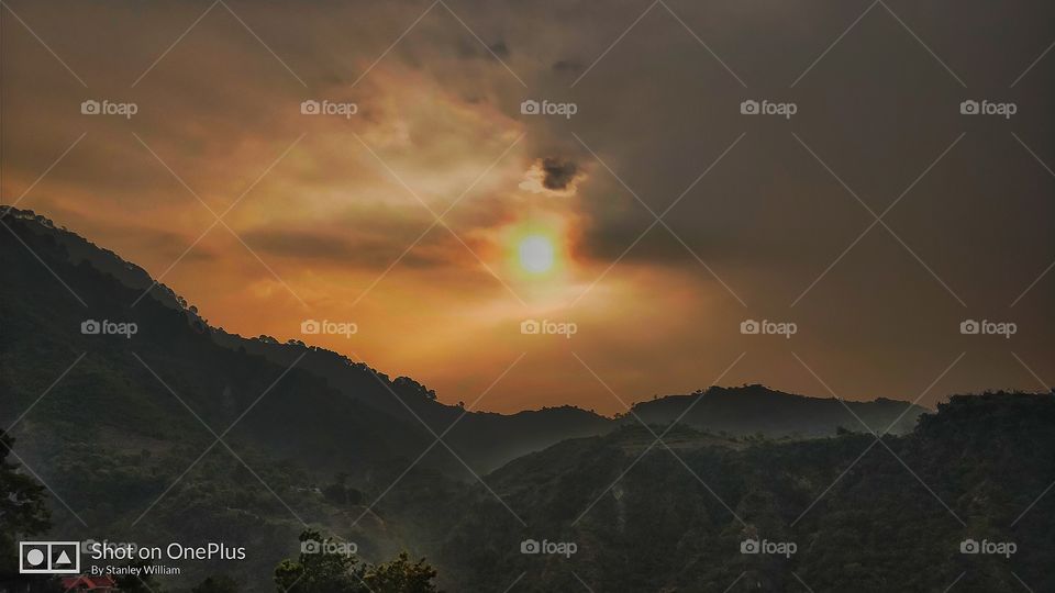 Sun set scene behind the hill