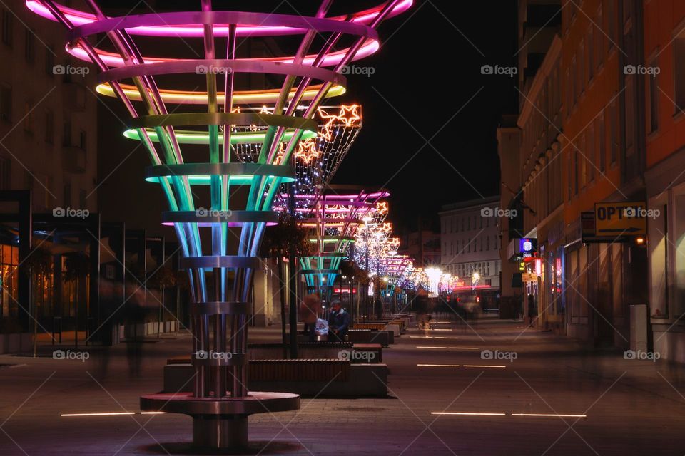 main promenade of the city with rainbow decorative lamps