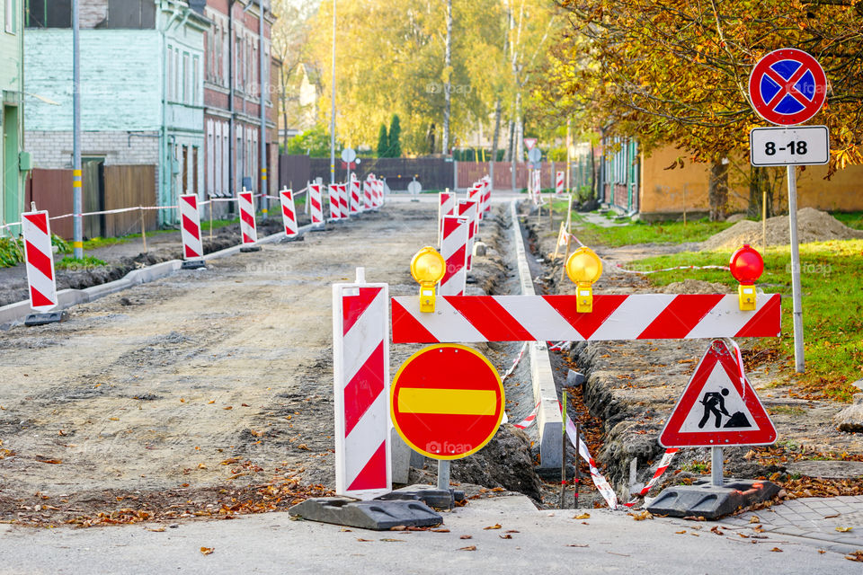 traffic constraints during street repair in city, warning signs