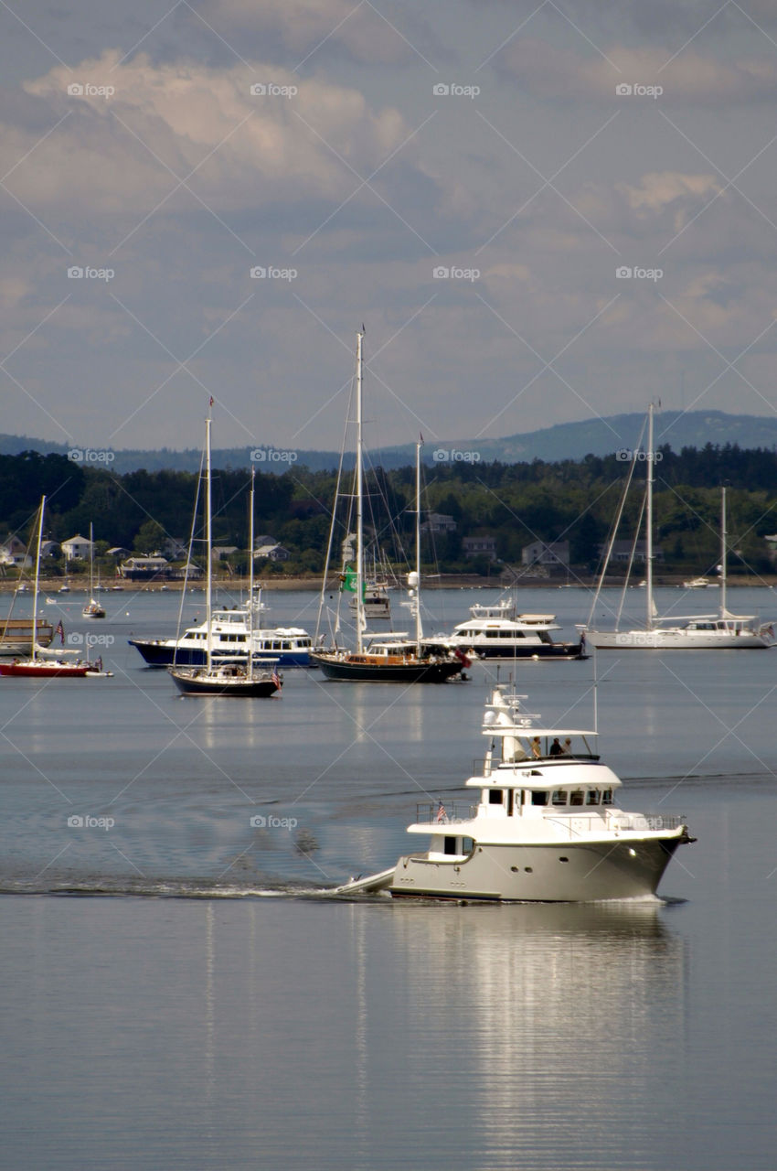 Yacht cruises the harbor of Castine Maine