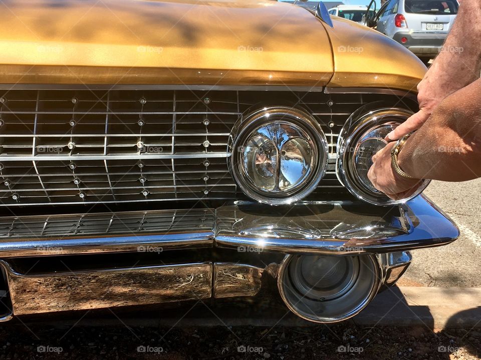 1961 Gold Cadillac De Ville, cats eye headlights and chrome grill 