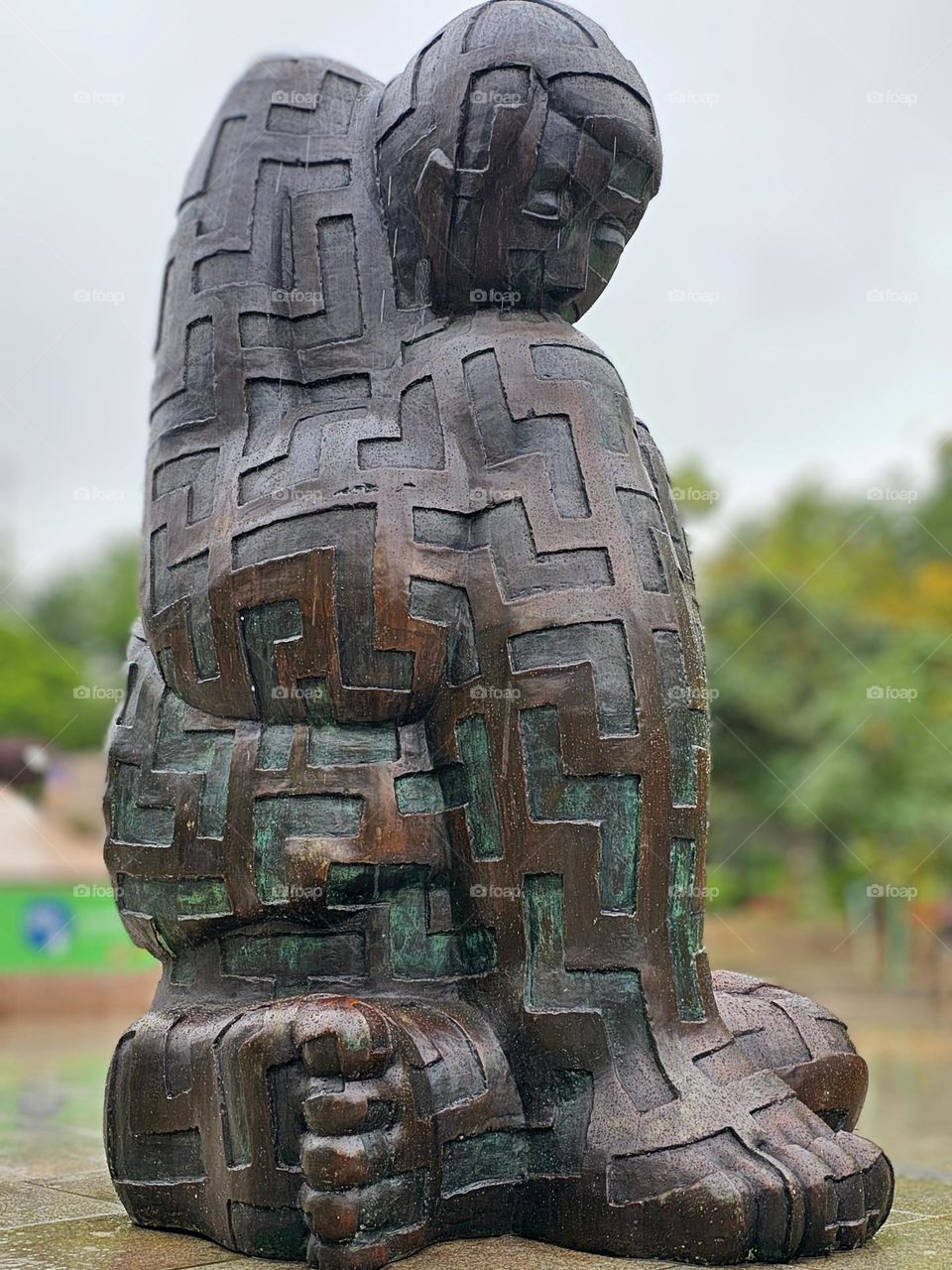 Hugging self bronze statue in Hong Kong