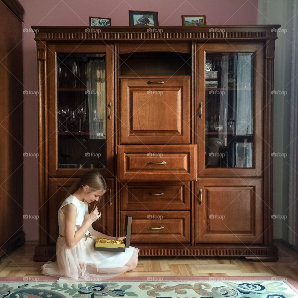 Girl tasting chocolates alone