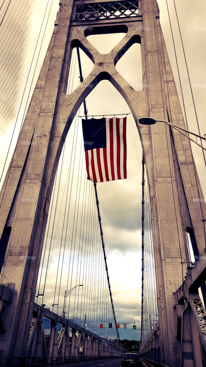 American flag waving from the Hudson bridge.